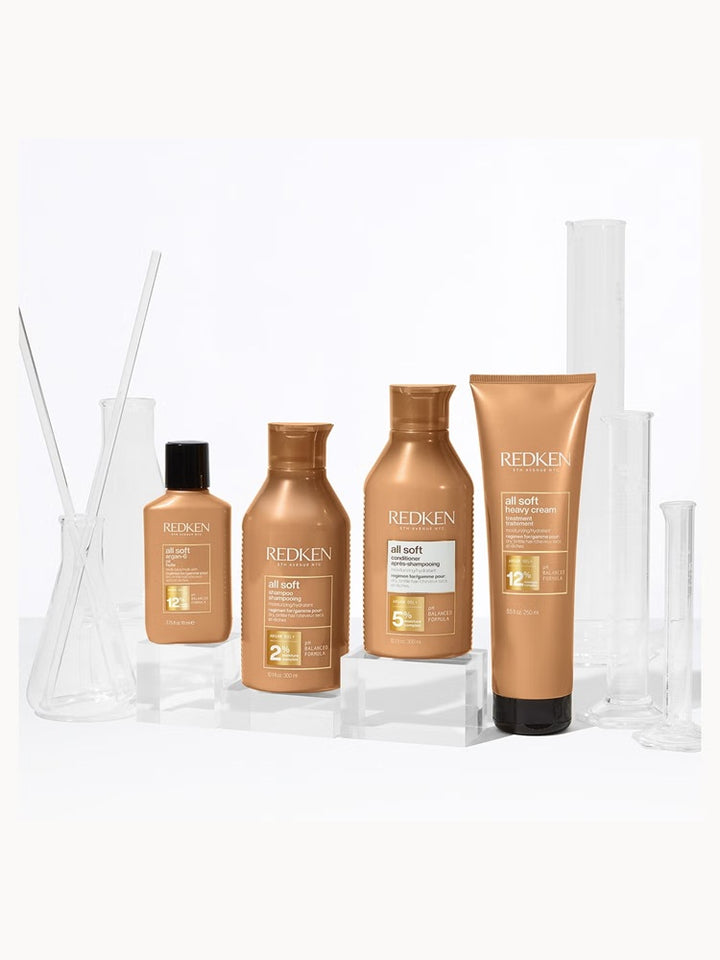 Redken All Soft range bottles and tubes displayed together