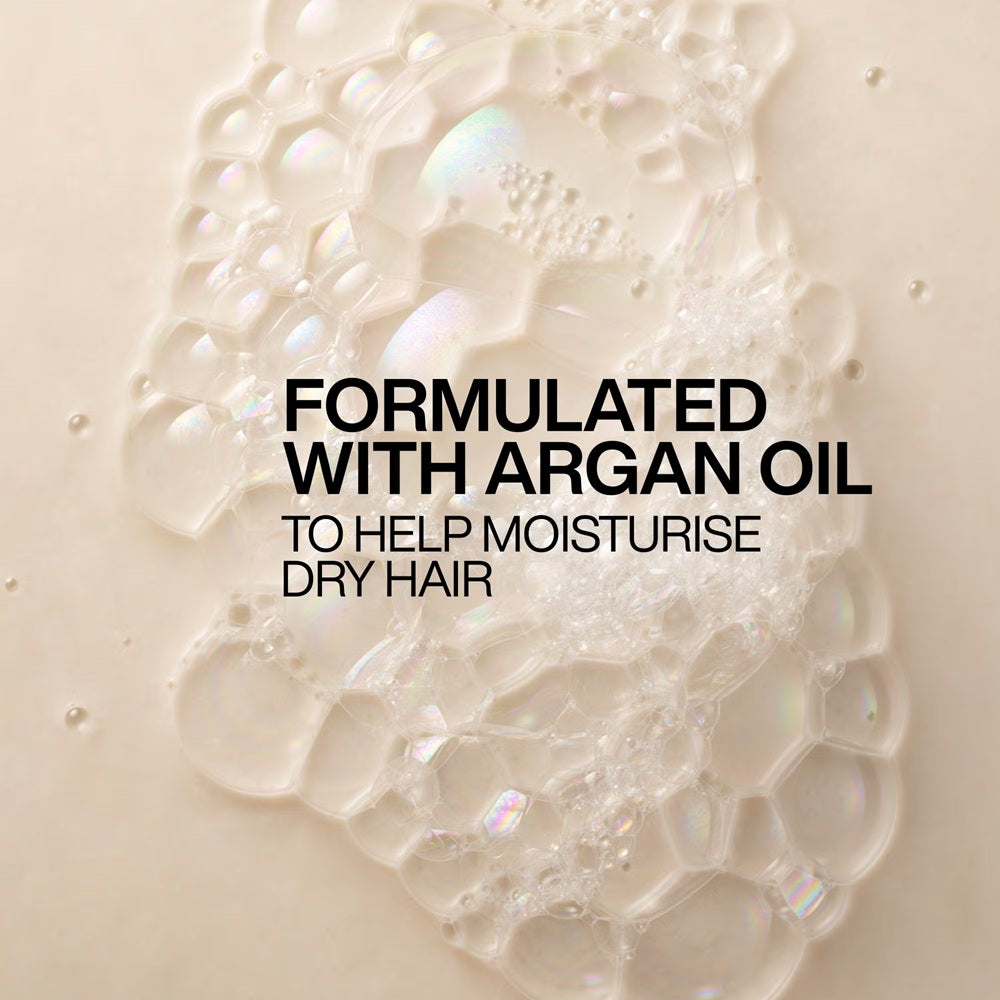 Close-up of Redken All Soft shampoo lather formulated with argan oil