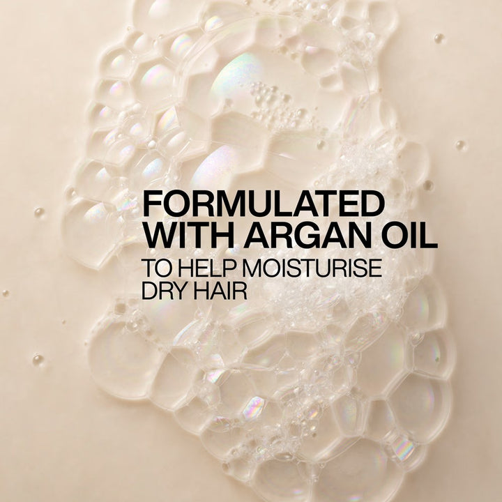 Close-up of Redken All Soft shampoo lather formulated with argan oil